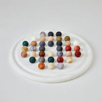Alabaster Solitaire Game Set, shown in white and multicolor earth tones with alabaster and stone.