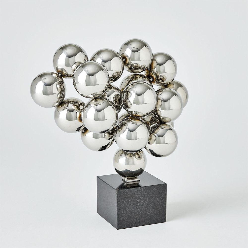 Sphere Sculpture, shown in chrome silver and polished gold with metal, stone, and a freestanding pedestal base.