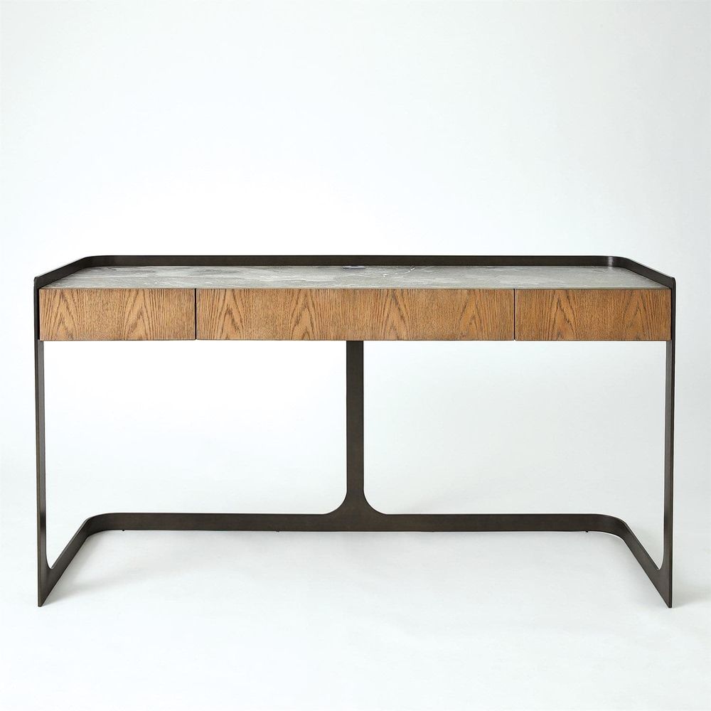 Element Desk, shown in warm oak brown and gray stone with wood, stone, and three-drawer storage front.