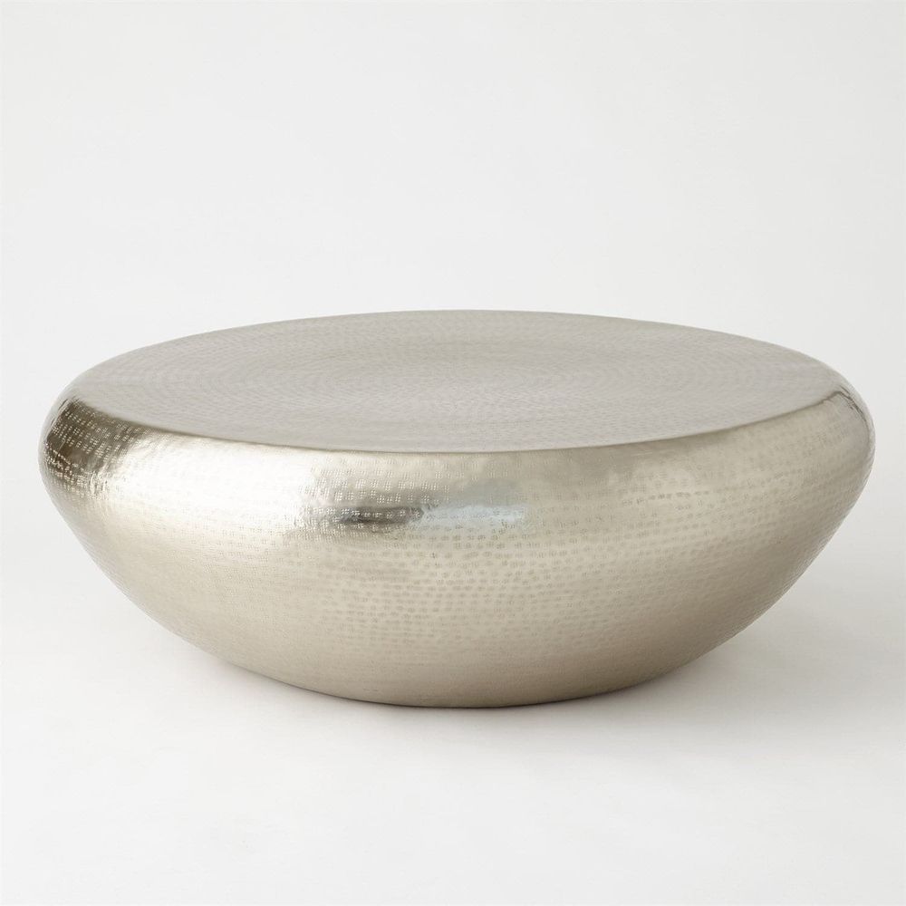 Goa Cocktail Table, shown in silver and gold with metal and a solid continuous drum base.