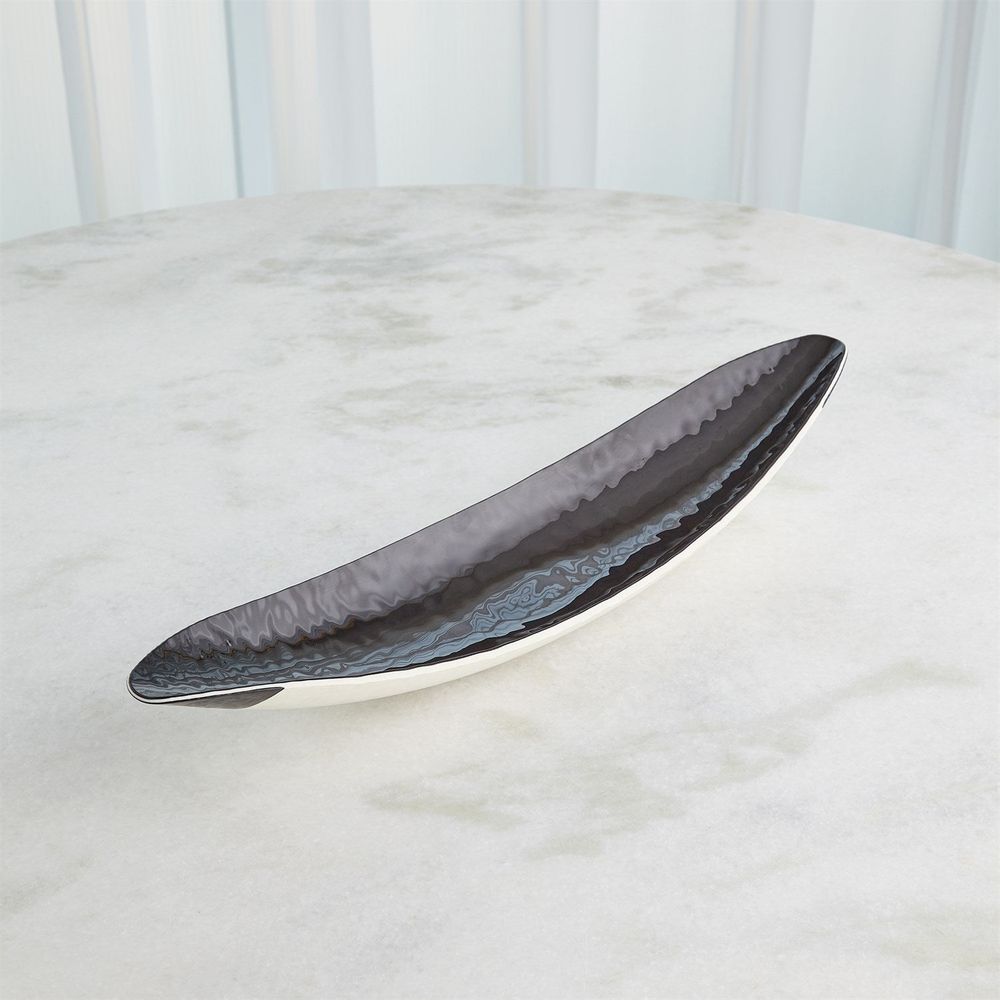 Ebony Ivory Gondola Bowl, shown in ebony black and ivory with ceramic and shallow open elongated serving basin.