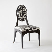 Additional view of Harlow Zebra Dining Chair in black and white, featuring glossy lacquer and fixed armless frame.