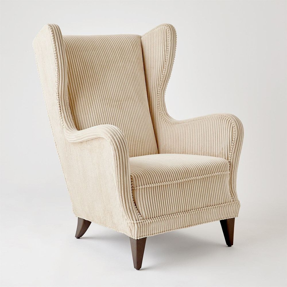 Additional view of Wing Chair in cream and ivory, featuring ribbed textile finish and fixed arms.