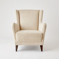 Lounge Chair, shown in cream and ivory with corduroy fabric, wood, and fixed arms.