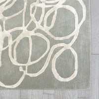 Additional view of Scribble Rug in sage gray and ivory, featuring high-low relief finish and high-low pile relief pattern.
