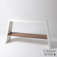 Eddy Console, shown in white and warm brown with textured composite, wood, and integrated lower display shelf.
