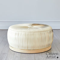 Alternate view of Colette Ottoman, featuring pleated finish, fabric, wood, and fixed wood plinth base.