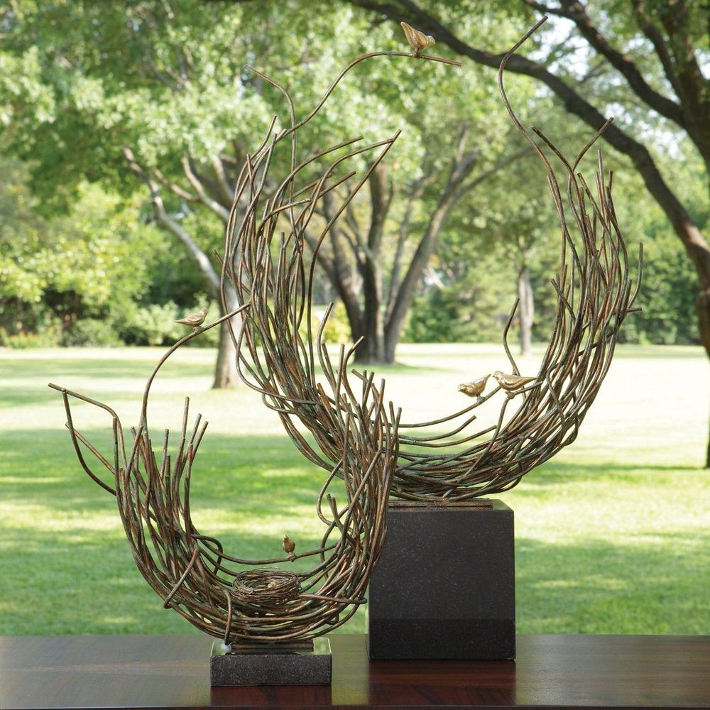 Alternate view of Bird's Nest, featuring verdigris patina, metal, stone, and a freestanding cubic stone base.