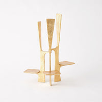 Triune Candleholder, shown in gold with metal, gold leaf, and three integrated staggered candle platforms.