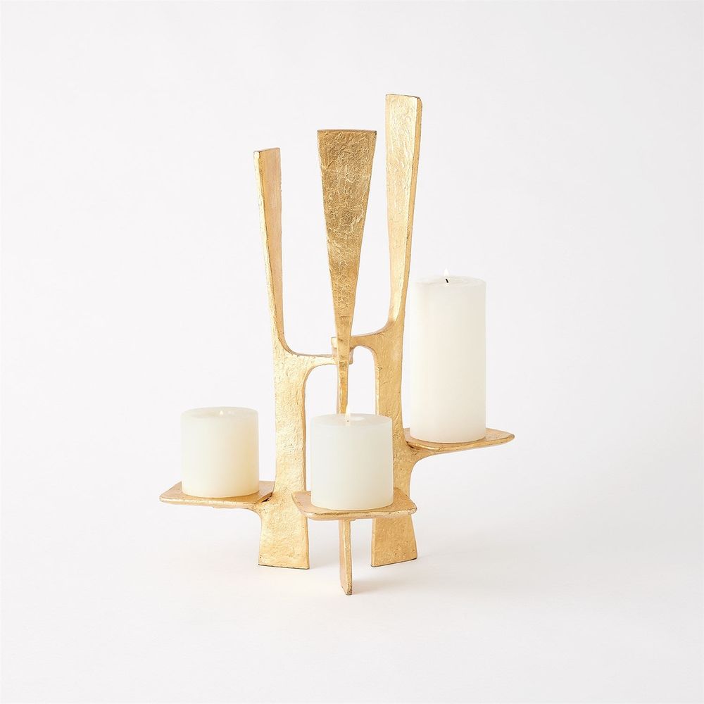 Additional view of Triune Candleholder in gold, featuring textured finish and three integrated staggered candle platforms.