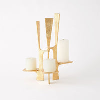 Additional view of Triune Candleholder in gold, featuring textured finish and three integrated staggered candle platforms.