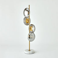 Stellar Table Lamp-Smoke/Brass, shown in brass gold and smoke gray with smoked glass and brass.