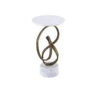 Ruban Accent Table, shown in white and antique brass with marble, cast aluminum, and a compact round accent surface.