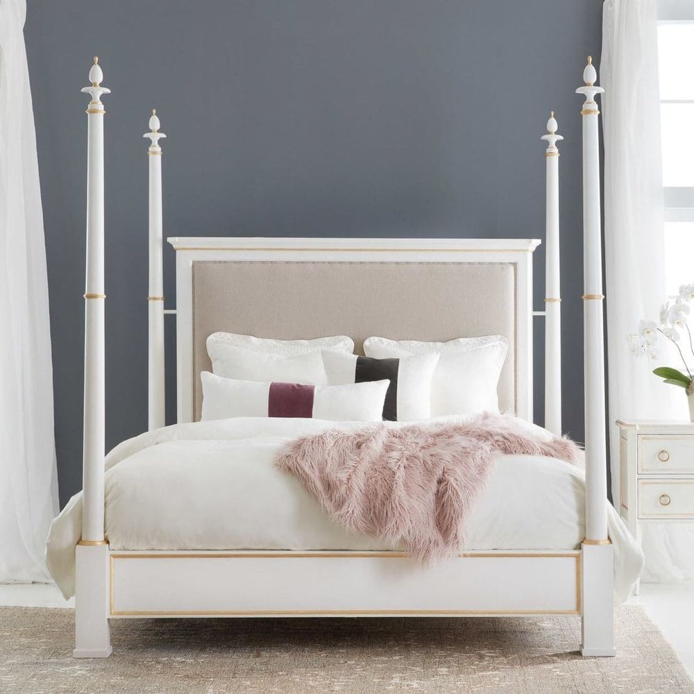 Covington Poster Bed, shown in white and cream with wood, upholstered fabric, and four tall poster posts.