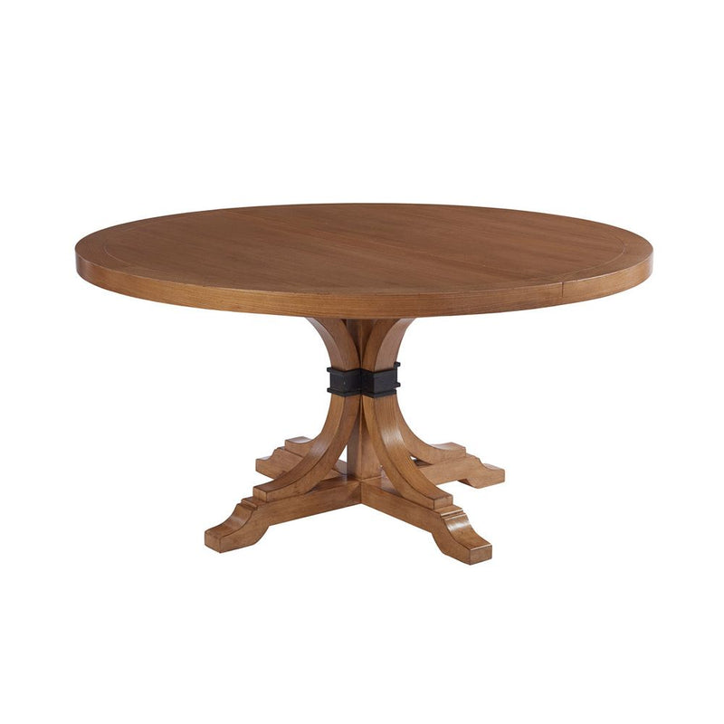 Magnolia Round Dining Table, shown in medium warm brown and honey oak with wood and metal.