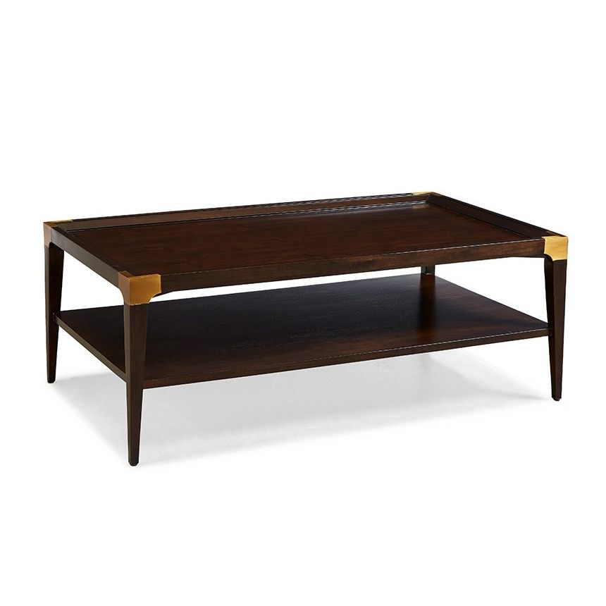 Addison Cocktail Table, shown in dark brown and antique brass with wood, brass, and full-width lower storage shelf.