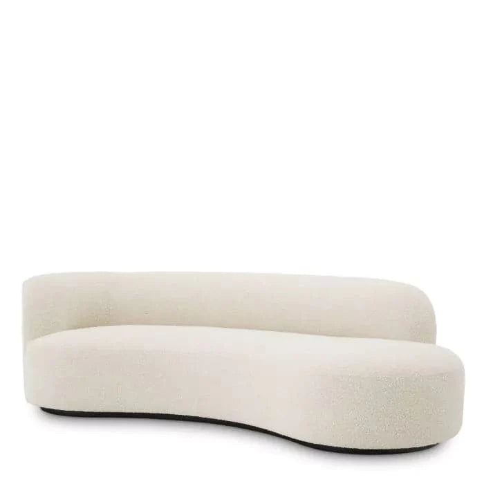 Sofa Morten, shown in cream and ivory with bouclé fabric, upholstery, and a low black plinth base.