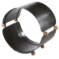 Westhaven Log Holder, shown in black and charcoal with hammered metal, wood, and open circular log storage cavity.