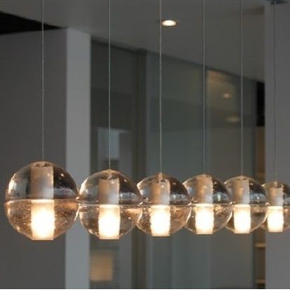 Beluga Pendant Lamp Clear Glass, shown in clear and warm white with glass, metal, and multi-light linear pendant suspension.