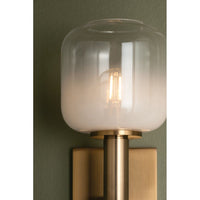 Alternate view of Axton Wall Sconce, featuring brushed metal finish, brass, glass, and wall-mounting hardware.