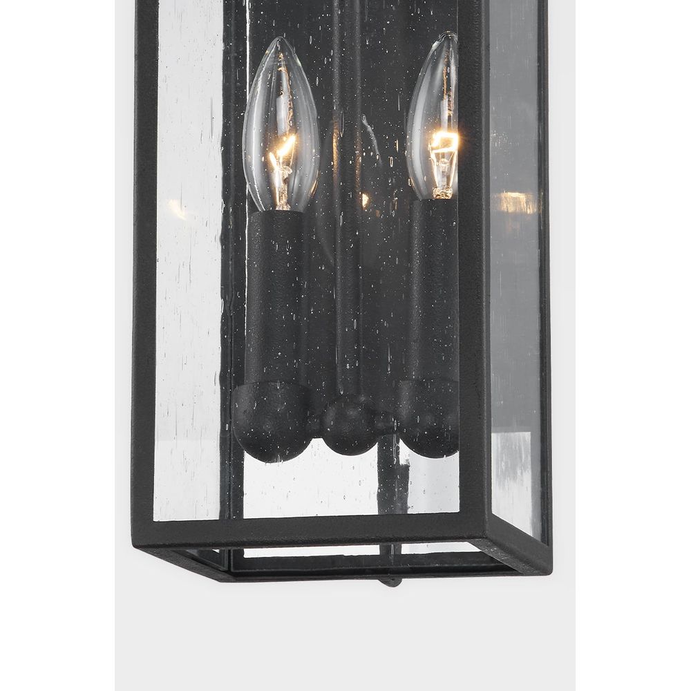 Additional view of Caiden Wall Sconce in black and clear, featuring matte textured finish and a wall-mounting backplate.