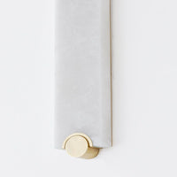 Alternate view of Brant, featuring polished metal finish, alabaster, brass, and wall-mounting hardware.