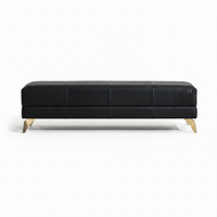 Berkeley End-Of-Day Bench, shown in black with leather, metal, and fixed angled metal legs.