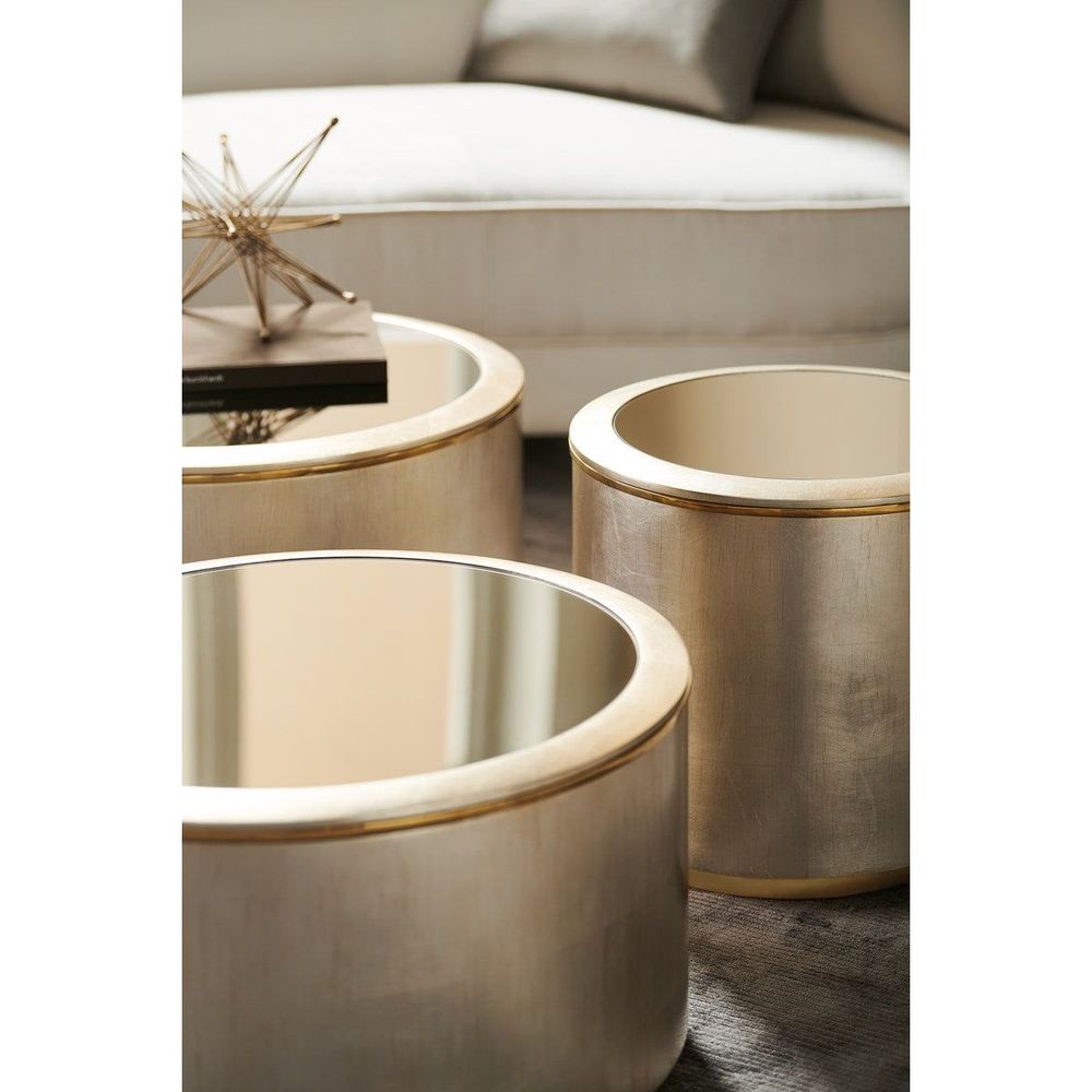 Additional view of Orbit Bunching Accent Table, showing low cylindrical drum in champagne and brushed gold.