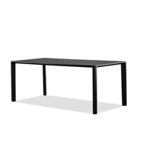Alternate view of Plank Dining Table, featuring matte finish, teak, wood, and fixed four-leg base.