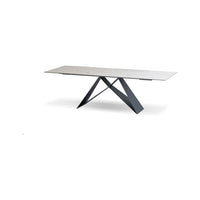 The W Double Extension Dining Table Carrara White Ceramic Top, Black Powder Coated Steel Base in white and black.