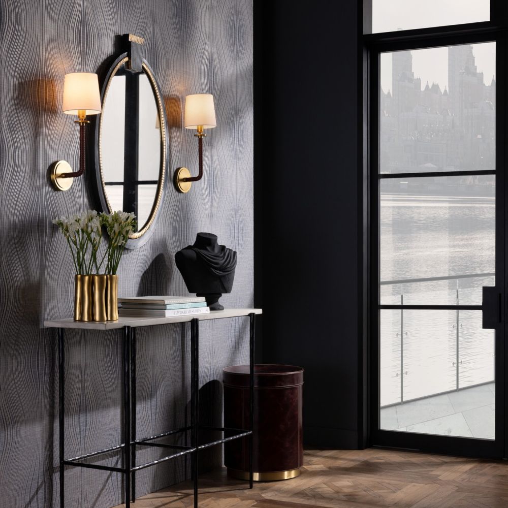 Alternate view of Swell Sconce, featuring wrapped leather finish, fabric, metal, and a wall-mounting backplate.