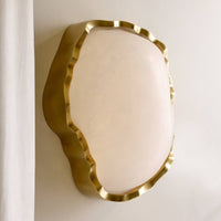 Alternate view of Novak Sconce, featuring polished metal finish, alabaster, brass, and wall-mounting hardware.