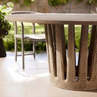 Additional view of Villard Outdoor 65" Round Dining Table in warm gray-brown and taupe.