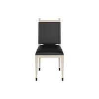 Thistlewood Dining Chair, shown in black and light beige with leather, wood, and fixed four-leg base.
