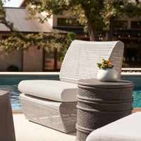 Additional view of Sagebrush Outdoor Chair in gray and off-white, featuring open-weave lattice finish and armless open sides.