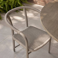 Additional view of Balint Outdoor Dining Chair, featuring matte powder-coated, rope, metal, and fixed continuous arms.