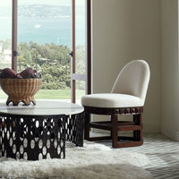 Alternate view of Truett Chair, featuring matte upholstery finish, fabric, wood, and a swivel base.