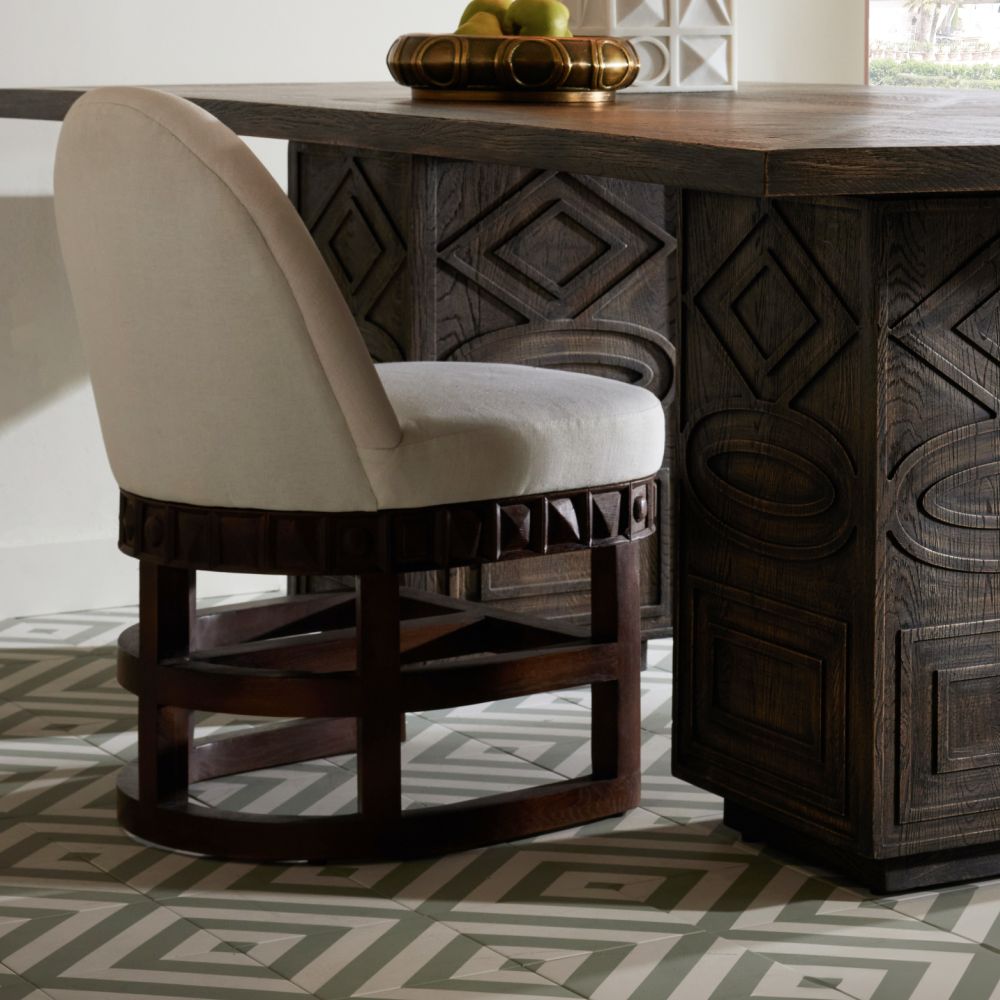 Additional view of Truett Chair in cream and dark brown, featuring matte upholstery finish and a swivel base.