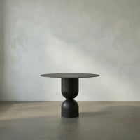 Alternate view of Wanda Dining Table, featuring matte finish, steel, iron, and a round pedestal base.