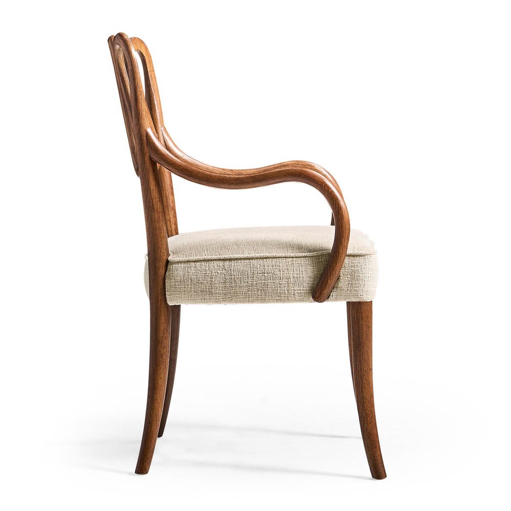 Additional view of Ampney Toasted Oak Arm Chair, featuring matte upholstery finish, oak wood, woven fabric, and fixed arms.