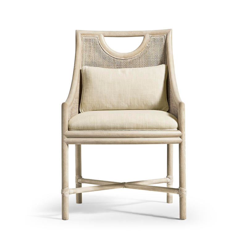 Fjord Dining Chair, shown in light beige and natural cane tan with wood, cane rattan, and fixed open arms.