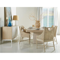 Alternate view of Fjord Dining Chair, featuring matte upholstery finish, wood, cane rattan, and fixed open arms.