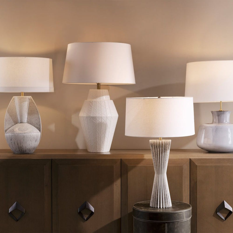 Alternate view of Bellamy Lamp, featuring distressed, ceramic, linen, and a freestanding weighted base.