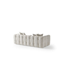 Additional view of Cloud Sofa in ivory and off-white, featuring soft upholstered and fixed rounded arms.
