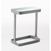 Saddle Table, shown in gray and bronze with metal, glass, and open c-shaped saddle base for sliding under seating.