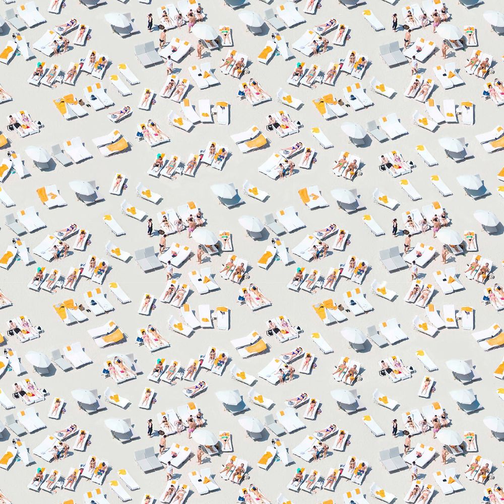 Sunbathers Wallpaper, shown in sand beige and white with printed wallpaper and continuous wall-covering pattern.