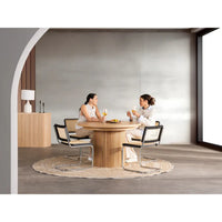 Additional view of The Transformer Round Table in light oak and natural blonde wood.
