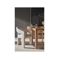 Additional view of Vesper Chair in ivory and off-white, featuring fixed continuous arms.