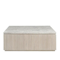 Carmen Cocktail Table, shown in light gray and warm beige with stone, wood, and a square cocktail/coffee table surface.
