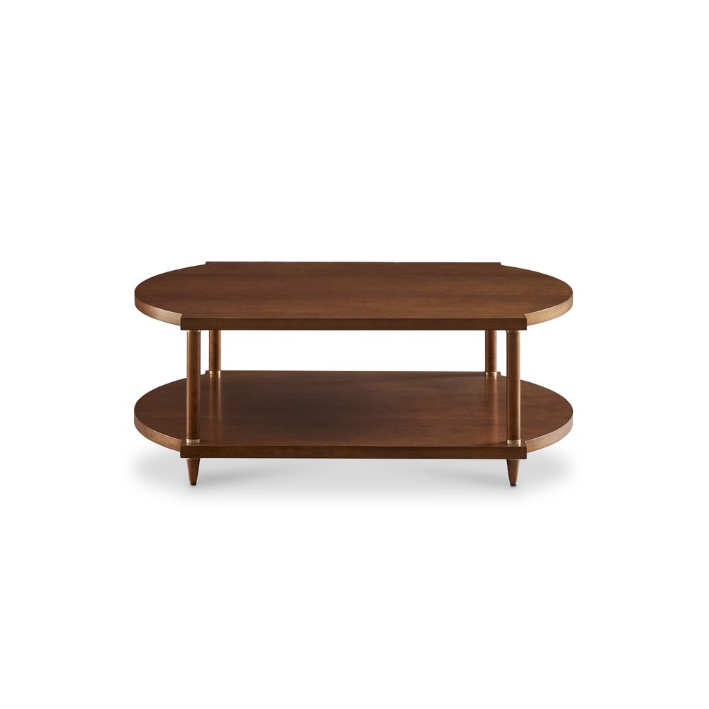 Lainey Cocktail Table, shown in warm medium brown and walnut brown with wood, brass, and open lower display shelf.